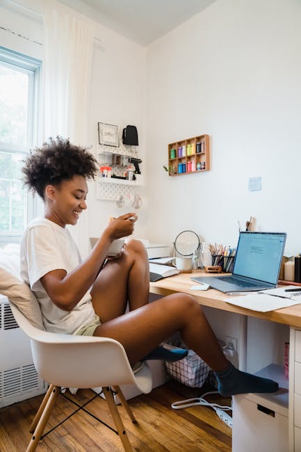 Person working at a clean, organized desk and smiling with a relaxed posture